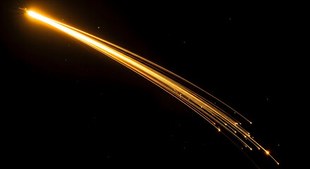 Fototapeta premium A bright streak of light trails across the dark sky as a meteor or comet burns up in the atmosphere leaving a glowing path