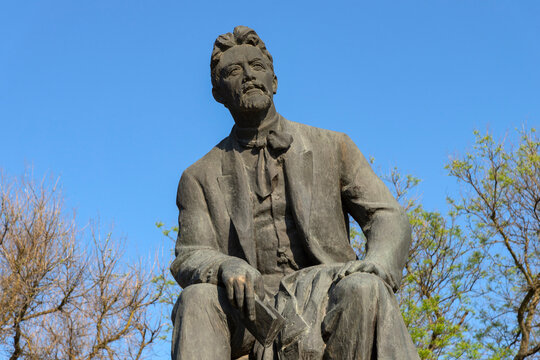 TAGANROG, RUSSIA - MAY 07, 2025: Monument to writer Anton Pavlovich Chekhov against a blue spring sky. Taganrog, Rostov region
