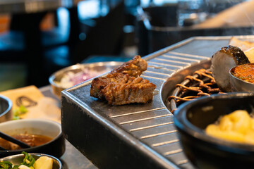 a piece of grilled pork belly on the table