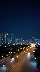 Obraz premium Blurred Bokeh City Lights at Night Creating a Dreamy Urban Atmosphere