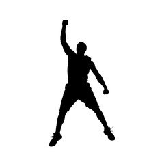 Obraz premium Silhouette of a man celebrating victory with raised arm and clenched fist.