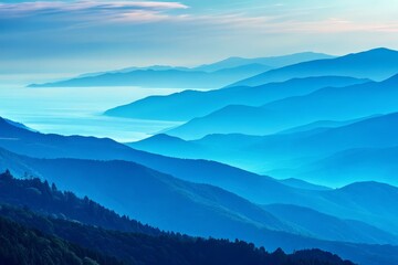 Fototapeta premium Serene blue mountain ranges with lush greenery under soft sky