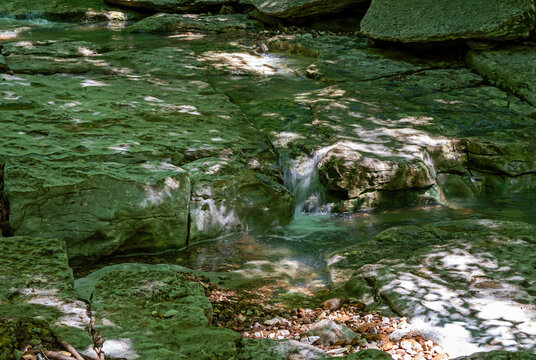 Tiny cascade over rocky ledge