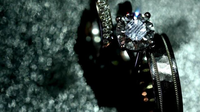 Cinematic close-up of a solitaire diamond engagement ring on dark texture. Expansive gift for a lover, engagement ring , wedding anniversary, 