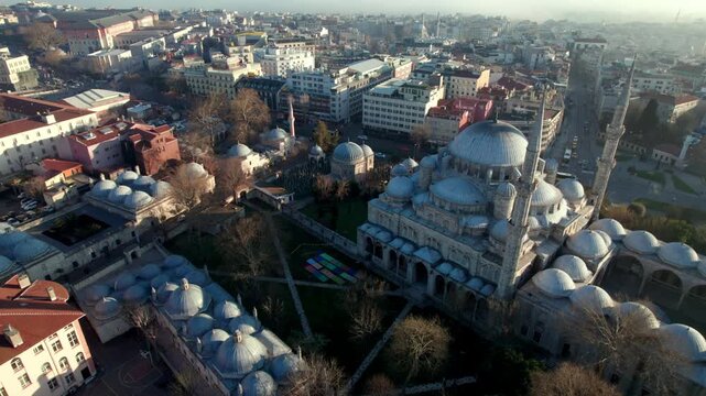 Wide aerial view of Sehzade Mosque and its kulliye in the Fatih district of Istanbul. Ottoman architecture, dome composition and dense urban surroundings reveal the scale of the historic peninsula.