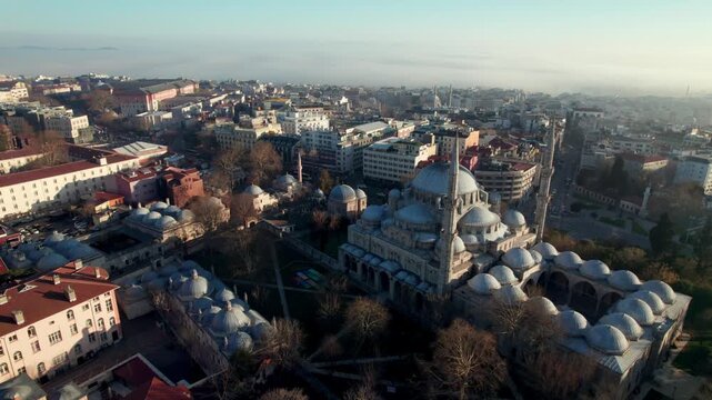 Wide aerial view of Sehzade Mosque and its kulliye in the Fatih district of Istanbul. Ottoman architecture, dome composition and dense urban surroundings reveal the scale of the historic peninsula.