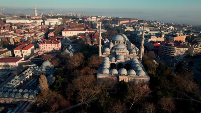 Wide aerial view of Sehzade Mosque and its kulliye in the Fatih district of Istanbul. Ottoman architecture, dome composition and dense urban surroundings reveal the scale of the historic peninsula.