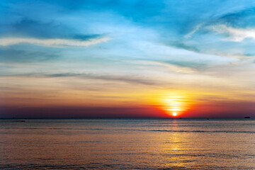 Fototapeta premium A beautiful colorful blue-orange sunset over the Gulf of Thailand in Vietnam. Desktop wallpaper. Nature. Travel concept.