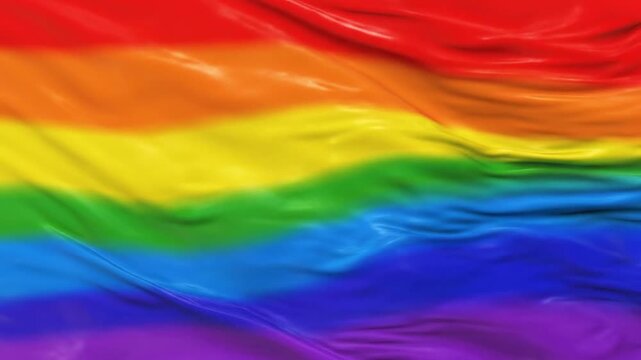 Flowing Rainbow Fabric Flag Captured in Close-Up View Emphasizing Texture and Celebration