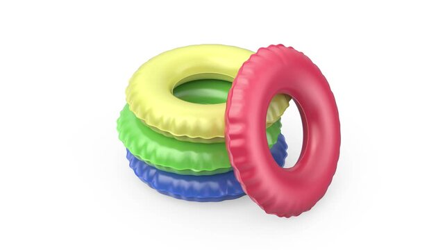 Group of swim rings in different colors on white background