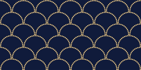 Golden beads fish scales seamless pattern. Elegant navy blue background with matte gold beaded arched lines. Luxury mermaid scale texture for wallpaper, textile, wrapping, and greeting cards. © Mockups and Variety