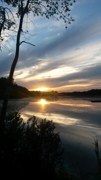 Dramatic dreamy sunset over Lake Fred nestled in the New Jersey Pine Barrens at Stockton University.