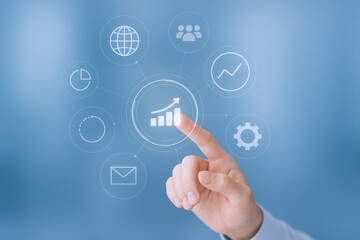 Digital Growth Strategy Concept: Hand Touching Chart Icon on Futuristic Interface for Business Success