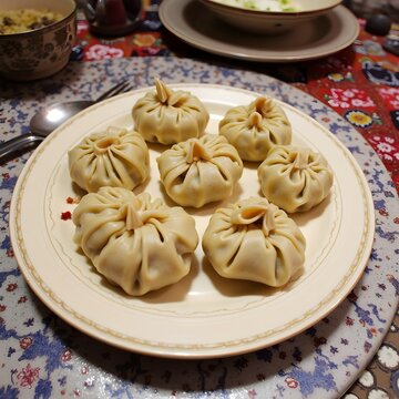 Mongolian food. A plate of traditional buuz dumplings. Juicy, steamed dumplings filled with seasoned meat and onions.