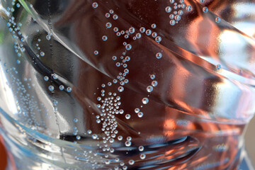 Bubbles dance in a refreshing drink captured in sunlight