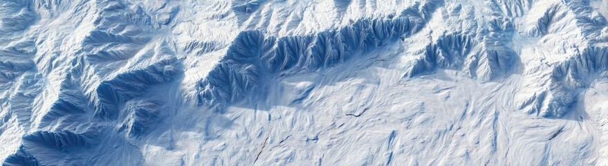 Panoramic view of a snow-covered mountain range with detailed texture