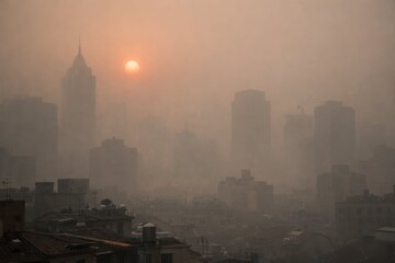 Fototapeta premium Sooty Sunset Over Skyscrapers in a Hazy Urban Landscape