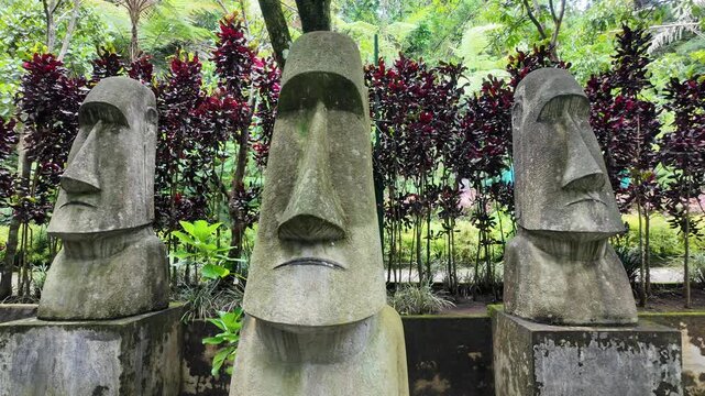 Moai Statues in a Serene Garden Setting.