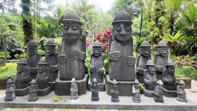 Moai Statues in Tropical Garden Setting.