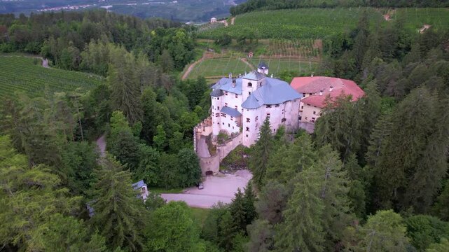 Castel Bragher Aerial Drone View over Pine Trees Medieval Castle Trentino Italy Fairytale Fortress Vineyards Alpine Forest Val di Non Landscape Panorama Scenic Mountain Travel Destination Historic