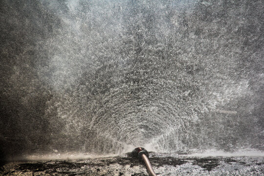 A water diffuser is a firefighting device that shoots water into the air to rain down on a fire