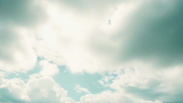 Bright blue sky dotted with soft white cumulus clouds, evoking peaceful, airy openness and a fresh, uplifting sense of freedom and tranquil new beginnings