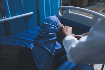 Asian male doctor examining foot of female patient sitting on bed in hospital room. Performing medical checkup. Diagnosing injury. Providing healthcare. Podiatry. Physical therapy. And rehabilitation