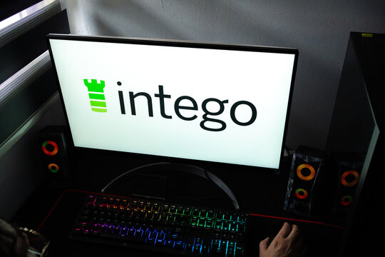 Punta Arenas, Chile &ndash; February 18, 2026: A person at a desk with the Intego Mac security and antivirus software logo displayed on a computer monitor