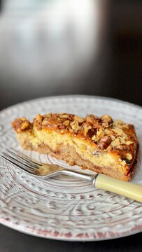 slice of homemade Ladysmith cake on a light plate with a fork