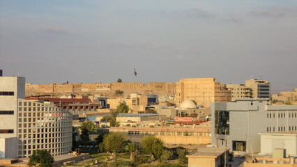 Overhead view of the Citadel of Erbil, Iraq, seen from a cable car in Minare Park, with the city in the foreground