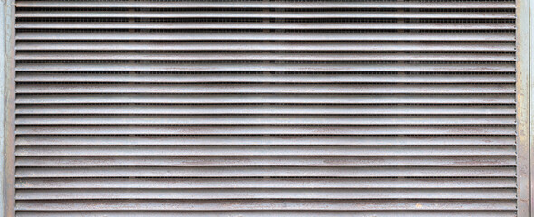 Obraz premium Metal louvers forming an industrial air vent texture