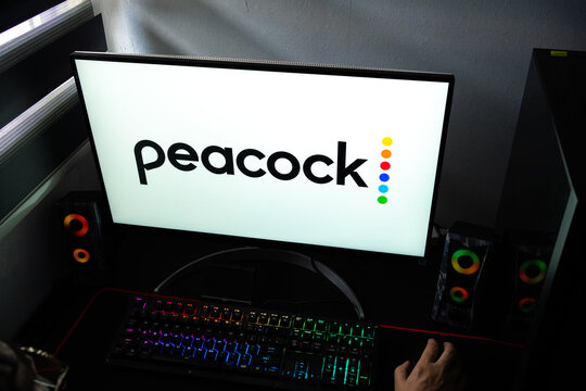 Punta Arenas, Chile &ndash; February 18, 2026: A person at a desk with the Peacock video-on-demand streaming service logo displayed on a computer monitor