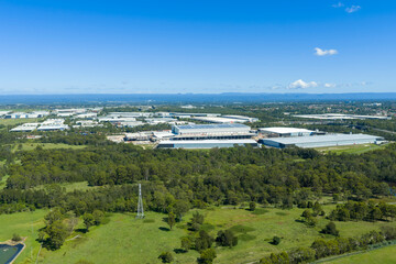 Naklejka premium Drone aerial photograph of buildings in an industrial precinct in the suburb of Eastern Creek in greater Sydney in New South Wales, Australia.