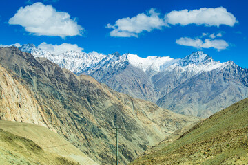 Snowy Himalayan peaks, blue sky at Chang La,southern pass, high mountain pass in Ladakh in the Greater Himalaya between Leh and the Shyok River valley. Leh to Pangong Lake road. Leh, Ladakh, India.