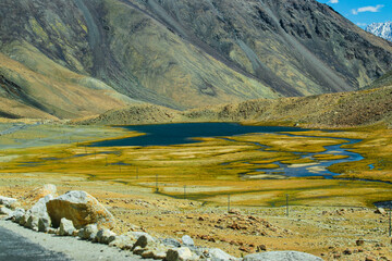 View of lakes and river with snowy mountain peak at Chang La , southern pass, a high mountain pass in Ladakh in the Greater Himalaya between Leh and the Shyok River valley. Leh, Ladakh, India.
