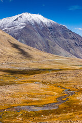 View of lakes and river with snowy mountain peak at Chang La , southern pass, a high mountain pass in Ladakh in the Greater Himalaya between Leh and the Shyok River valley. Leh, Ladakh, India.
