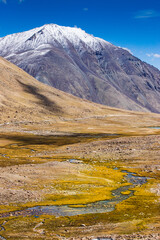 View of lakes and river with snowy mountain peak at Chang La , southern pass, a high mountain pass in Ladakh in the Greater Himalaya between Leh and the Shyok River valley. Leh, Ladakh, India.