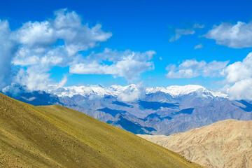 Snowy Himalayan peaks, blue sky at Chang La,southern pass, high mountain pass in Ladakh in the Greater Himalaya between Leh and the Shyok River valley. Leh to Pangong Lake road. Leh, Ladakh, India.