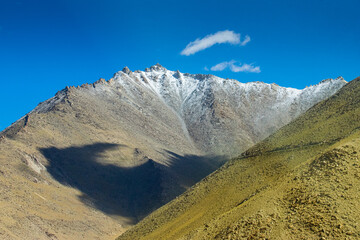 Beautiful Himalayas. Chang La , southern pass, high mountain pass in Ladakh between Leh to Pangong Lake road. On road view of shadow of cloud on Himalayan mountain. Leh, Ladakh, India.