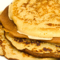 making very thin pancakes with Choux pastry, bubbly lacy texture 
