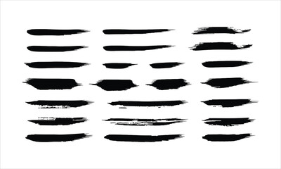 Set of black brush strokes and paint splatters on white background