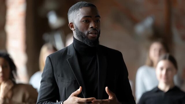 Medium shot of a professional speaker explaining ethical fund allocation principles to an engaged classroom audience during a seminar.