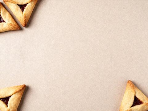 Delicious Hamantaschen Cookies on Neutral Background with Copy Space