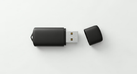 Black USB flash drive with cap removed, isolated on white background