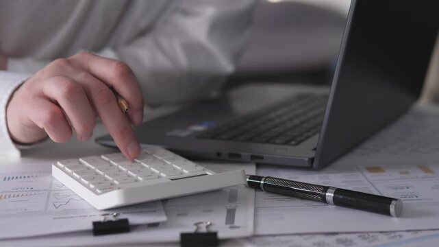 Performing Accurate Financial Calculations And Data Entry With Calculator Tools. Executing Business Financial Computations And Detailed Accounting Entries Utilizing Calculator Devices
