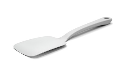 Fototapeta premium A white plastic spatula with a hole in the handle on a plain white background