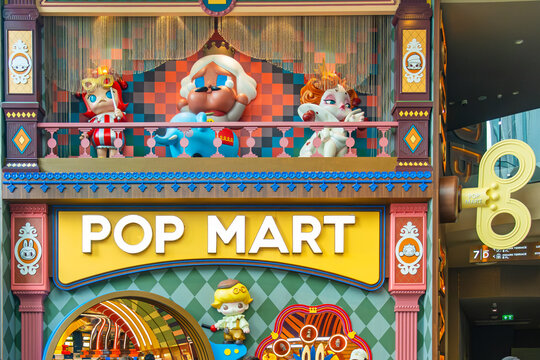Bangkok, Thailand - December 23, 2025: Colorful POP MART storefront with cartoon character balcony display in Iconsiam shopping mall. Designer toy, collectible culture and modern retail