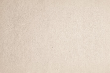 Fototapeta premium Beige paper material with grainy texture