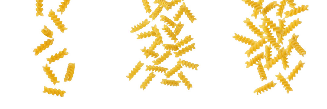 Set of Raw Spiral Fusilli Pasta Pieces Falling Isolated on White Background