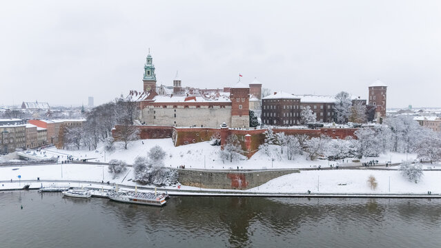 Aerial view of Wawel Castle in Krakow in winter, covered in snow.